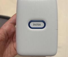 Impresora Polaroid Fujifilm Instax Blanca + funda
